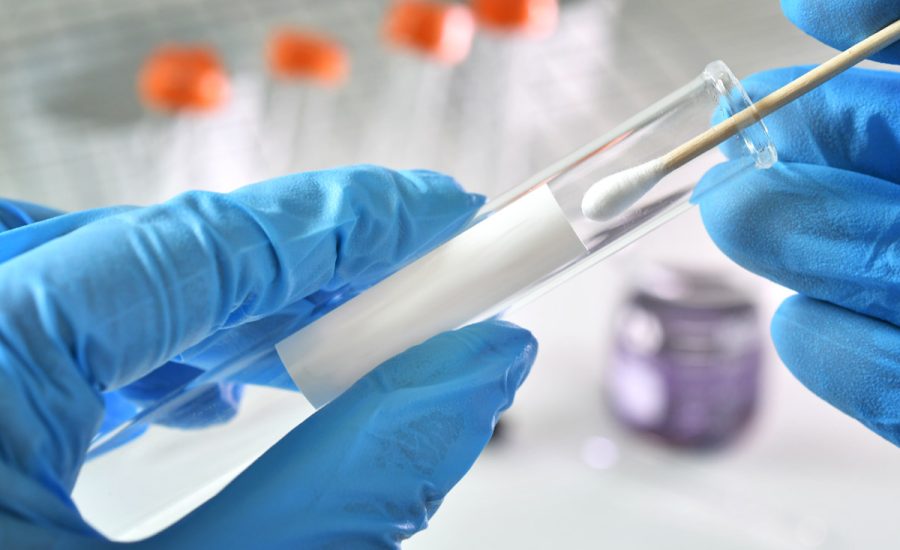 nasal-or-oral-testing-swab-being-inserted-test-tub-2022-12-08-17-23-12-utc